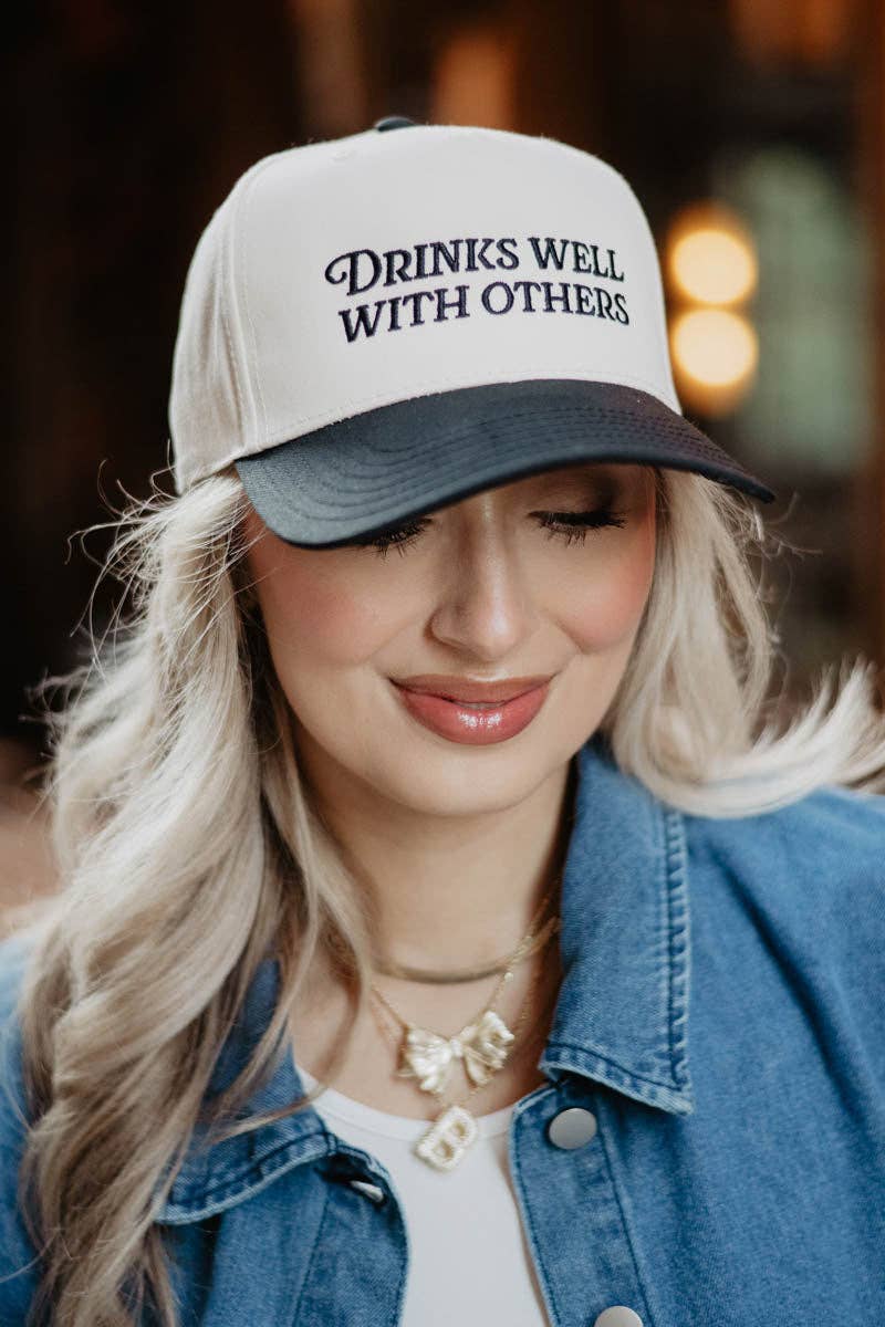 DRINKS WELL WITH OTHERS TRUCKER HAT